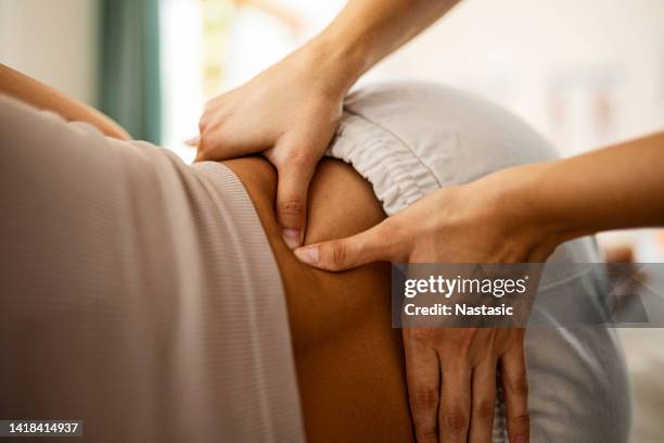 young woman at physical therapy program - neck exercise stock pictures, royalty-free photos & images