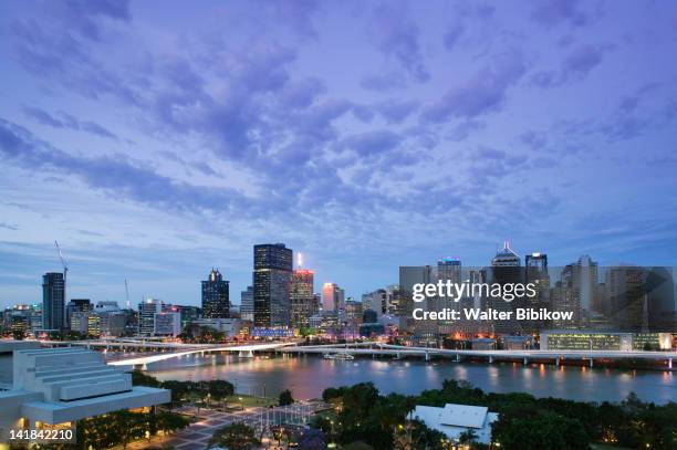 australia-queensland-brisbane: city skyline from southbank / evening - southbank brisbane stock pictures, royalty-free photos & images