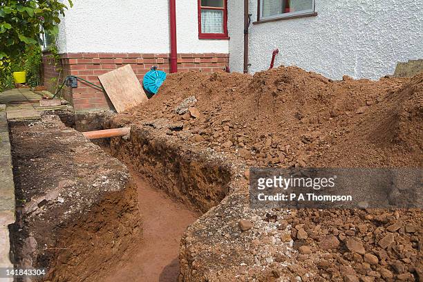 trench for footings on a house extension pr - archeologia foto e immagini stock
