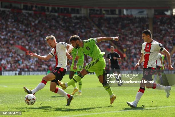 Bruno Fernandes of Manchester United shoots past James Ward-Prowse of Southampton during the Premier League match between Southampton FC and...