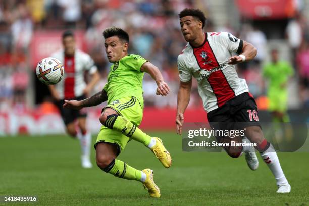 Lisandro Martinez of Manchester United is challenged by Che Adams of Southampton during the Premier League match between Southampton FC and...