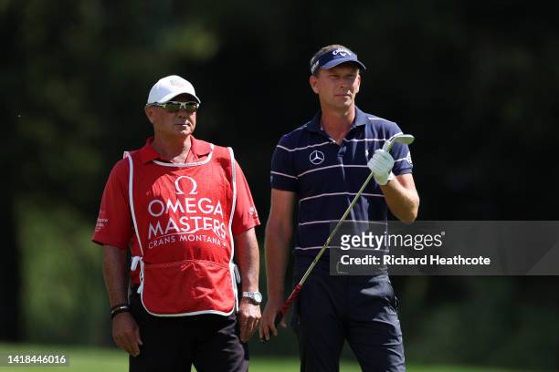 Marcel Siem of Germany with his caddy Kyle Roadley during Day Three of the Omega European Masters at Crans-sur-Sierre Golf Club on August 27, 2022 in...