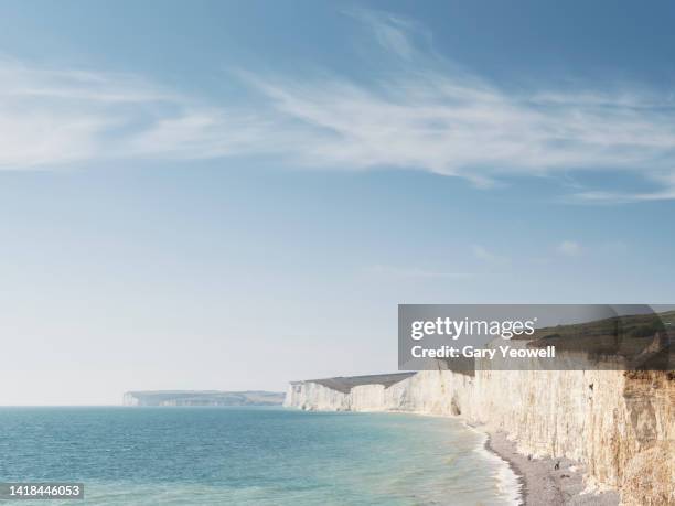 looking out over the sea to white cliffs at beachy head - looking over cliff stock pictures, royalty-free photos & images