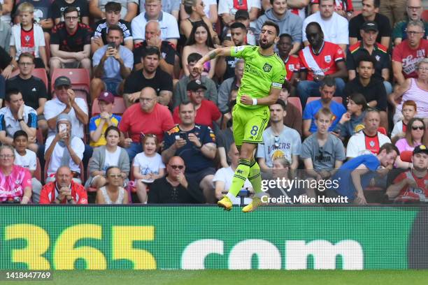 Bruno Fernandes of Manchester United celebrates after scoring their team's first goal during the Premier League match between Southampton FC and...