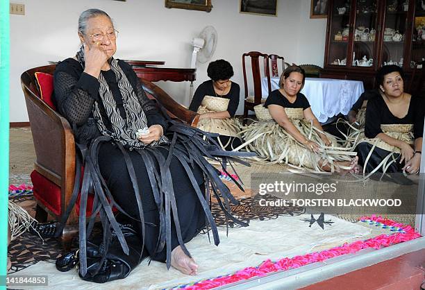 Queen Halaevala Mata'aho mourns the loss of her son, King George Tupou V, with Adi Litia Dugdale and Adi Elenoa Taito , both daughters of Fiji's high...