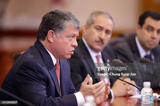 King Abdullah II of Jordan talks with South Korean President Lee Myung-bak during a meeting at the Presidential house on March 25, 2012 in Seoul,...