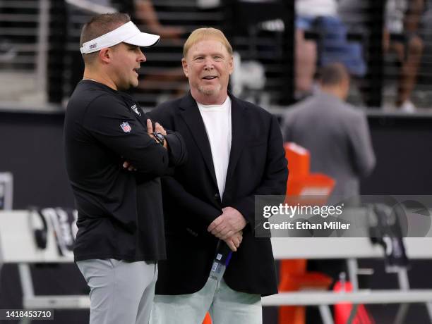 Head coach Josh McDaniels and owner and managing general partner Mark Davis of the Las Vegas Raiders talk before a preseason game against the New...