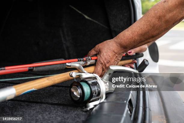 senior lady going to go fishing - fishing rod stock pictures, royalty-free photos & images