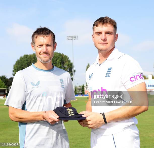 Former England Cricketer Chris Reads presents Alex Horton with a cap during a England U19 Nets Session at The Incora County Ground on August 27, 2022...