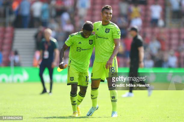 Tyrell Malacia and Casemiro of Manchester United celebrates after their sides victory during the Premier League match between Southampton FC and...
