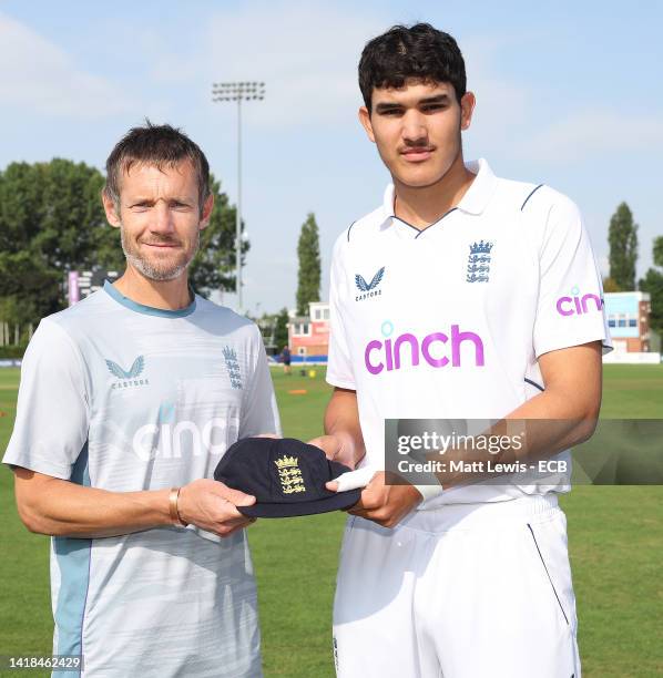 Former England Cricketer Chris Reads presents Harry Singh with a cap during a England U19 Nets Session at The Incora County Ground on August 27, 2022...