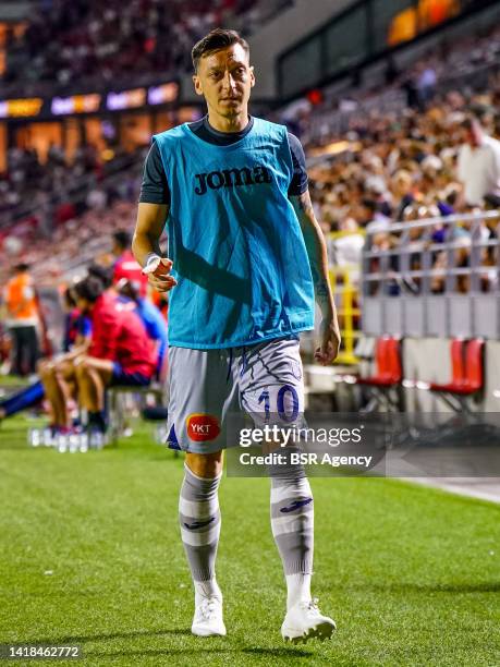 Mesut Ozil of Istanbul Basaksehir warms up during the UEFA Conference League Play-Off Second Leg match between Royal Antwerp FC and Istanbul...