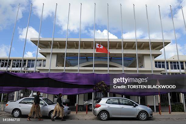 The Tongan national flag flies at half-mast as black and purple bunting adorns the International Dateline Hotel to mourn the death of King George...