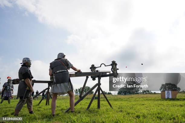 Roman re-enactors give a demonstration of Roman weaponry at Birdoswald Roman Fort on August 27, 2022 in Hexham, United Kingdom. 2022 is the 1900...