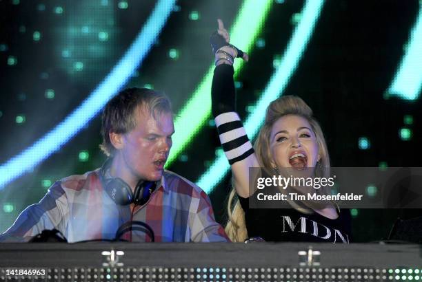 Avicii is joined by Madonna at Day Two of Ultra Music Festival 14 at Bayfront Park on March 24, 2012 in Miami, Florida.