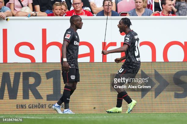 Jeremie Frimpong of Bayer Leverkusen celebrates their sides second goal with team mate Moussa Diaby during the Bundesliga match between 1. FSV Mainz...