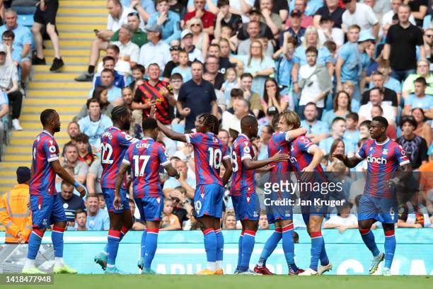Joachim Andersen of Crystal Palace celebrates their sides second goal with team mates during the Premier League match between Manchester City and...