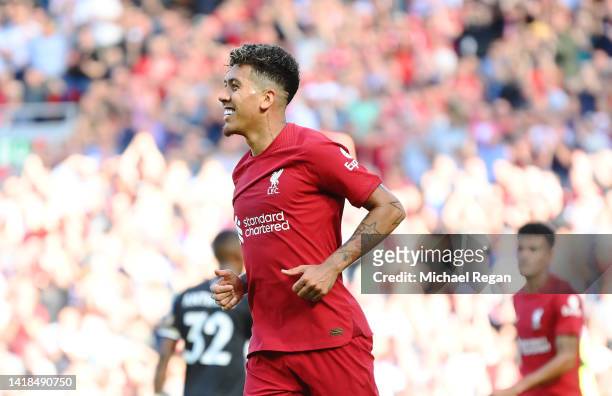 Roberto Firmino of Liverpool celebrates after scoring their team's seventh goal during the Premier League match between Liverpool FC and AFC...