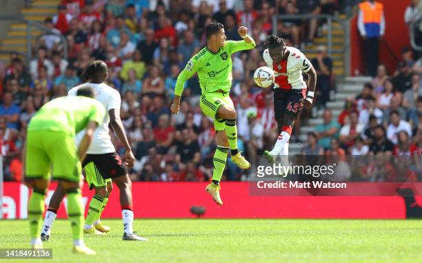 Cristiano Ronaldo of Manchester United and Romeo Lavia of Southampton during the Premier League match between Southampton FC and Manchester United at...
