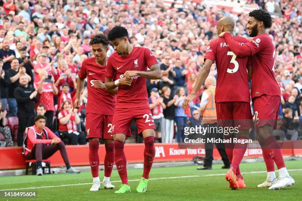 Luis Diaz of Liverpool celebrates with teammate Fabio Carvalho after scoring their team's ninth goal during the Premier League match between...