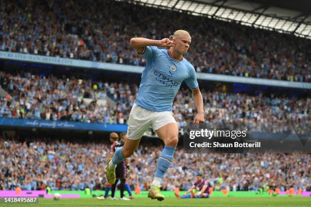 Erling Haaland of Manchester City celebrates their sides fourth goal and their hat trick during the Premier League match between Manchester City and...