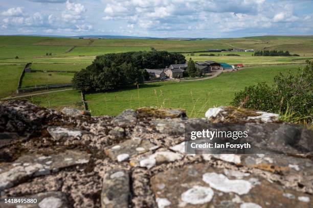 Farm sits in low ground near Hadrian's Wall at Cawfields quarry on August 27, 2022 in Hexham, United Kingdom. 2022 is the 1900 anniversary of the...