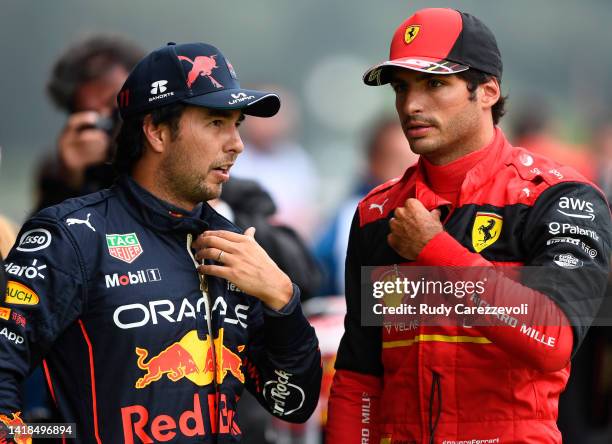 Second placed qualifier Carlos Sainz of Spain and Ferrari and Third placed qualifier Sergio Perez of Mexico and Oracle Red Bull Racing talk in parc...