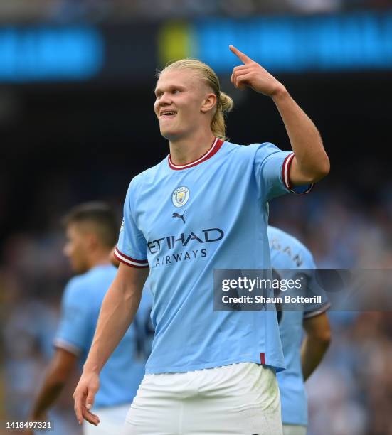 Erling Haaland of Manchester City celebrates their sides fourth goal and their hat trickduring the Premier League match between Manchester City and...