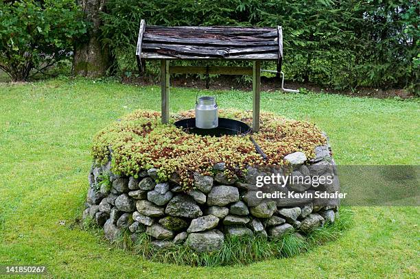 traditional well, olden village, nordfjord, norway - bohrloch stock-fotos und bilder