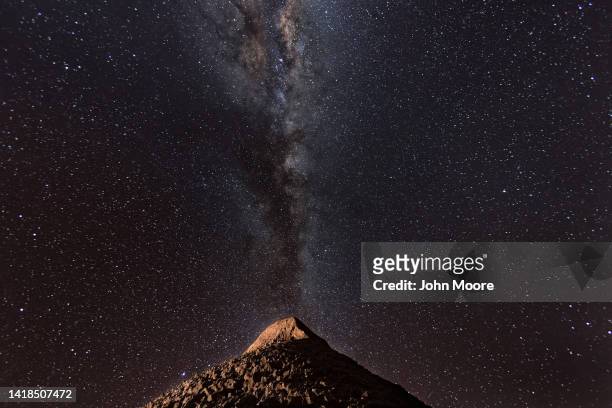 The Milky Way appears over a mountain in the Valle de la Luna in the Atacama Desert, considered the driest place on earth on August 26, 2022 near San...