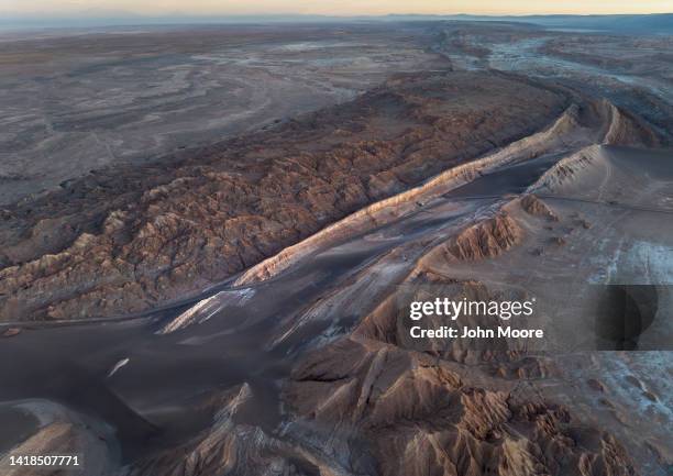 In this aerial view, twilight falls on the Valle de la Luna in the Atacama Desert, considered the driest place on earth on August 26, 2022 near San...