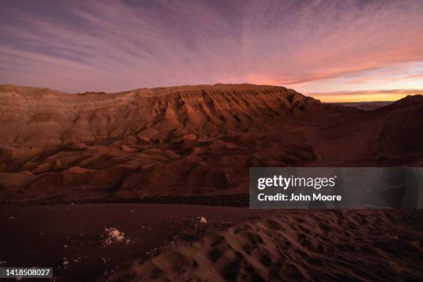 The sun sets on the Valle de la Luna in the Atacama Desert, considered the driest place on earth on August 26, 2022 near San Pedro de Atacama, Chile....