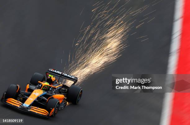 Sparks fly behind Lando Norris of Great Britain driving the McLaren MCL36 Mercedes during final practice ahead of the F1 Grand Prix of Belgium at...