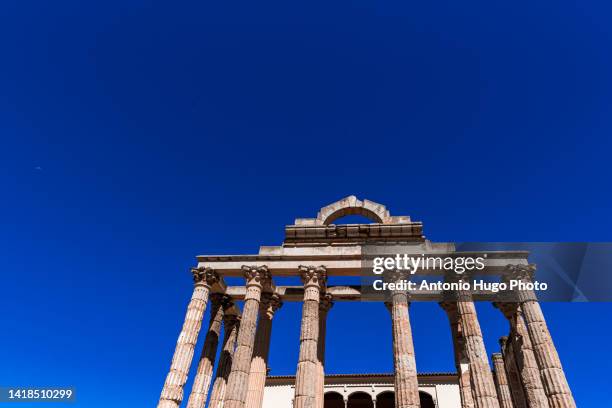 ruins of the ancient roman temple of diana in the city of merida, extremadura, spain. - diana roman goddess stock pictures, royalty-free photos & images