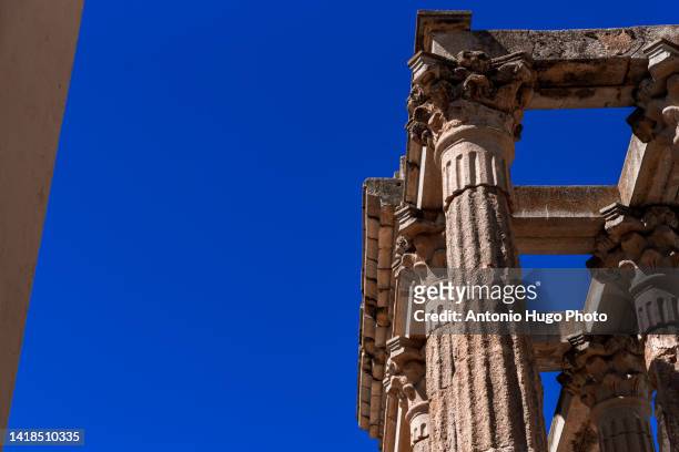 ruins of the ancient roman temple of diana in the city of merida, extremadura, spain. - diana roman goddess stock pictures, royalty-free photos & images