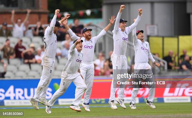 England captain Ben Stokes and the slips celebrate after taking the final wicket of Lungi Ngidi during day three of the Second test match between...