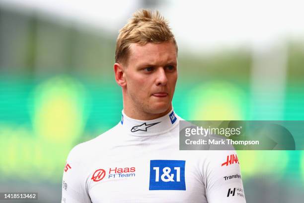 15th place qualifier Mick Schumacher of Germany and Haas F1 walks in the Pitlane during qualifying ahead of the F1 Grand Prix of Belgium at Circuit...