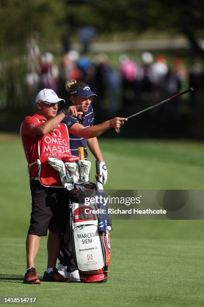 Marcel Siem of Germany with his caddy Kyle Roadley during Day Three of the Omega European Masters at Crans-sur-Sierre Golf Club on August 27, 2022 in...