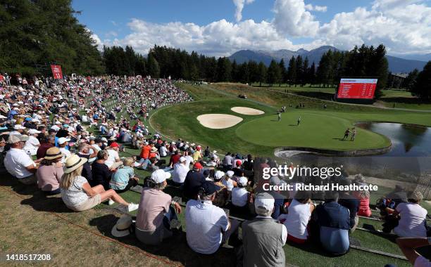 Spectators enjoying the sunny weather on the 13th during Day Three of the Omega European Masters at Crans-sur-Sierre Golf Club on August 27, 2022 in...