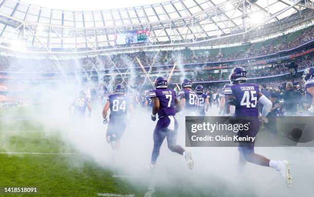 The Northwestern Wildcats team make their way out of the tunnel prior to the game at Aviva Stadium on August 27, 2022 in Dublin, Ireland.