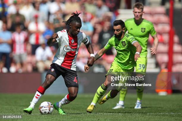 Romeo Lavia of Southampton breaks away from Bruno Fernandes of Manchester United during the Premier League match between Southampton FC and...