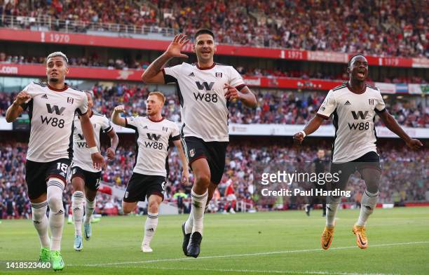 Aleksandar Mitrovic of Fulham celebrates their sides first goal during the Premier League match between Arsenal FC and Fulham FC at Emirates Stadium...