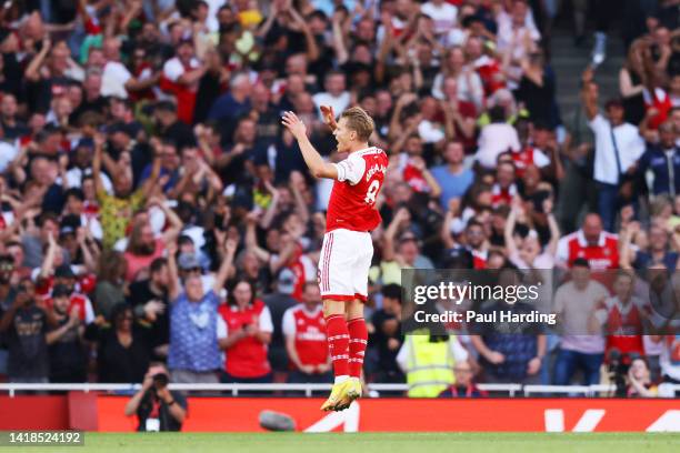 Martin Odegaard of Arsenal celebrates their sides first goal during the Premier League match between Arsenal FC and Fulham FC at Emirates Stadium on...