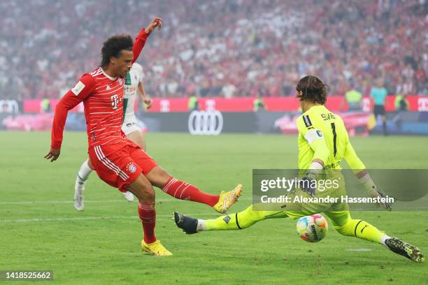 Leroy Sane of Bayern Munich has a shot saved by Yann Sommer of Borussia Monchengladbach during the Bundesliga match between FC Bayern München and...