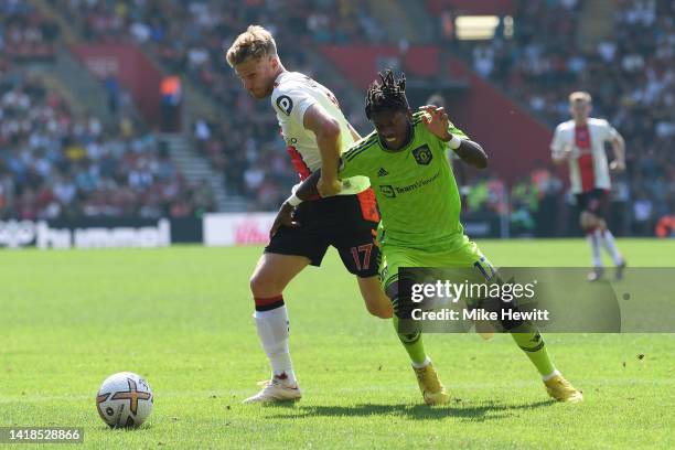 Fred of Manchester United battles with Stuart Armstrong of Southampton during the Premier League match between Southampton FC and Manchester United...