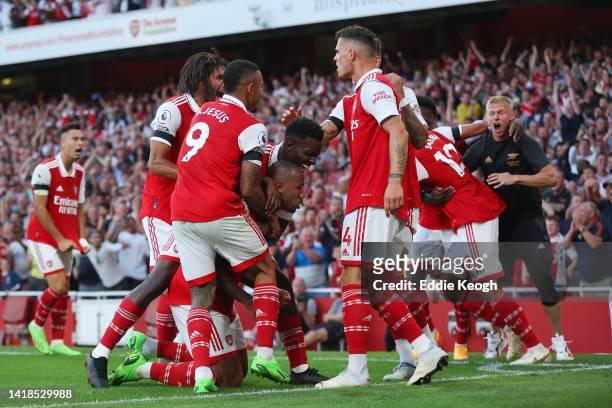 Gabriel Magalhaes of Arsenal celebrates their sides second goal with team mates during the Premier League match between Arsenal FC and Fulham FC at...