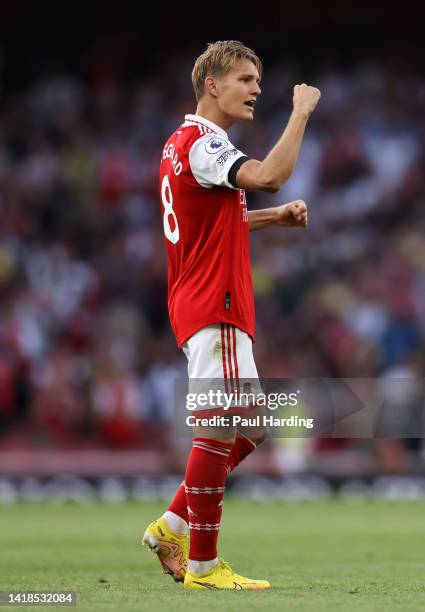 Martin Odegaard of Arsenal celebrates victory following the Premier League match between Arsenal FC and Fulham FC at Emirates Stadium on August 27,...