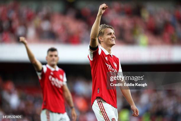 Martin Odegaard of Arsenal celebrates victory following the Premier League match between Arsenal FC and Fulham FC at Emirates Stadium on August 27,...