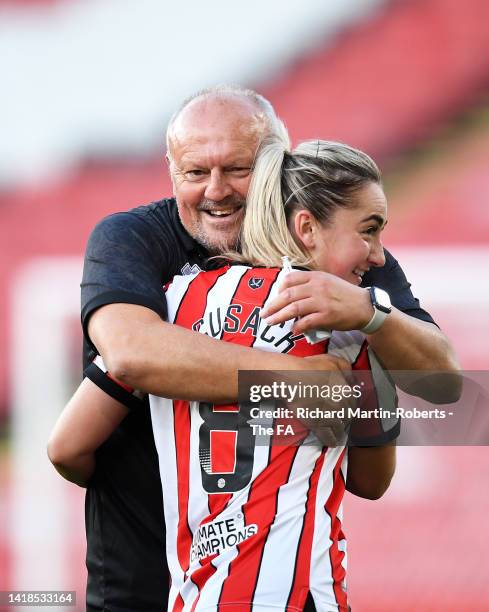 Neil Redfearn, Manager of Sheffield United embraces Madeleine Cusack of Sheffield United after the Barclays FA Women's Championship match between...