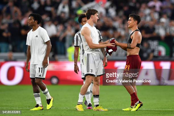 Dusan Vlahovic of Juventus and Paulo Dybala of AS Roma swap shirts following the Serie A match between Juventus and AS Roma at Allianz Stadium on...